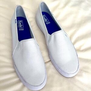 Women’s KEDS slip-ons; size 10. White. Worn for an afternoon, once. Very clean.
